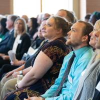 Guests watching a speaker at the Lynn M. Blue Connection Naming Ceremony